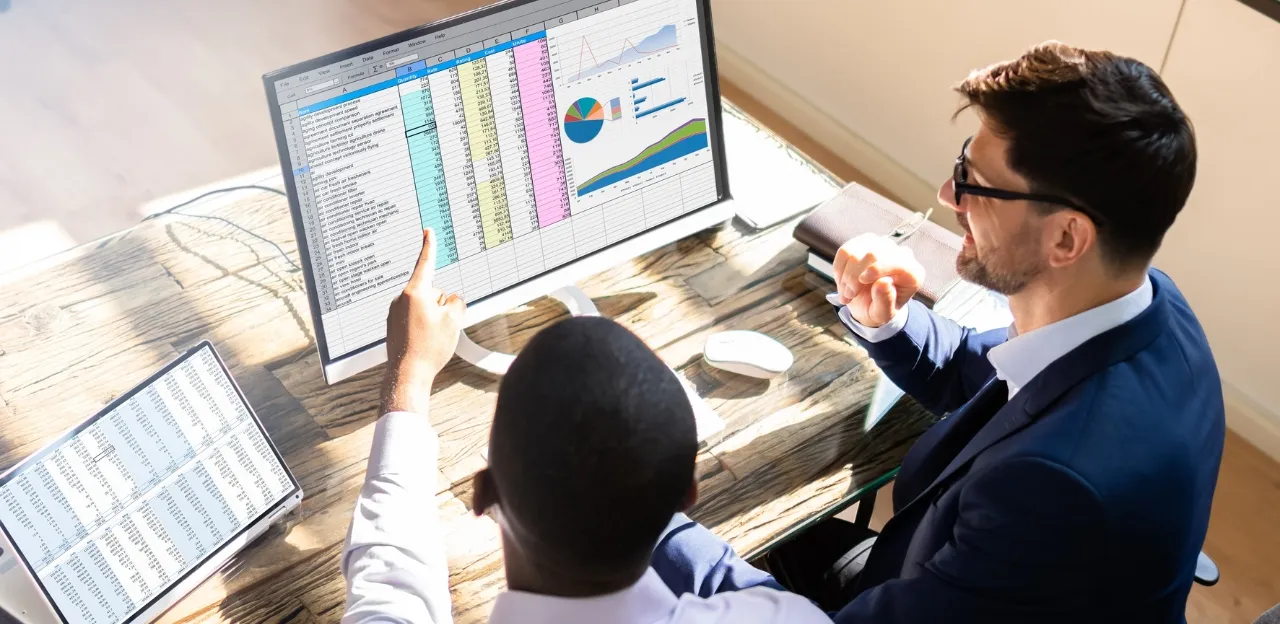 A professional in Bangalore analyzing data using SQL on multiple monitors, representing the technical requirement for modern data roles.